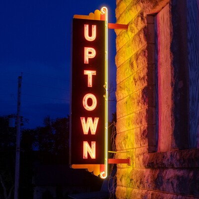 Lighting the newly hung neon sign for the first time