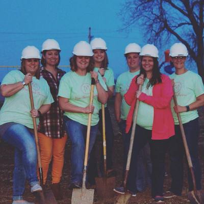The mommas breaking ground for the new park equipment in the spring of 2018.