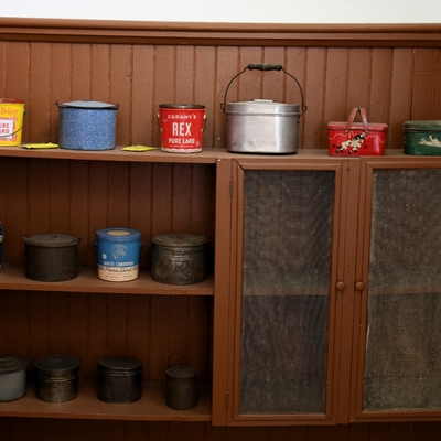 Lunch pail display in cabinet