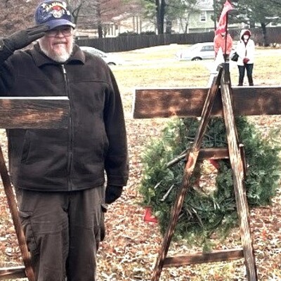 Quartermaster Nane Weaver renders hand salute at Wreaths Across America in Emporia, Kansas.