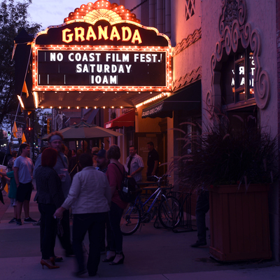 Visitors and community members outside the Granada