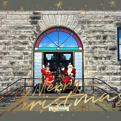 Santa & Mrs. Clause waving to the public from the top of the stairs to welcome Christmas!