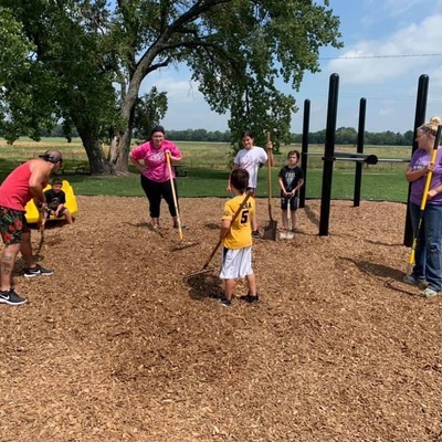Time to spread the mulch! Thanks to our kiddos for helping!!